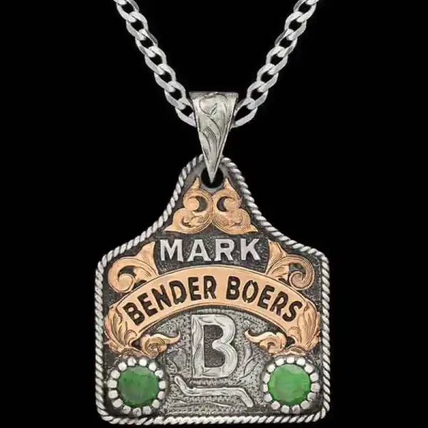 German Silver base measures 1.75"x1.50" with a touch of our classic antique, ranch logo, framed by our rope edge. Jewelers Bronze banner and hand-crafted scrollwork. 2 large Cubic Zirconias of your choice!

